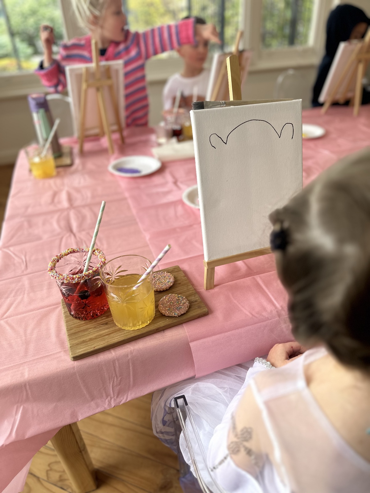 Children doing art at a Mini Ivy party