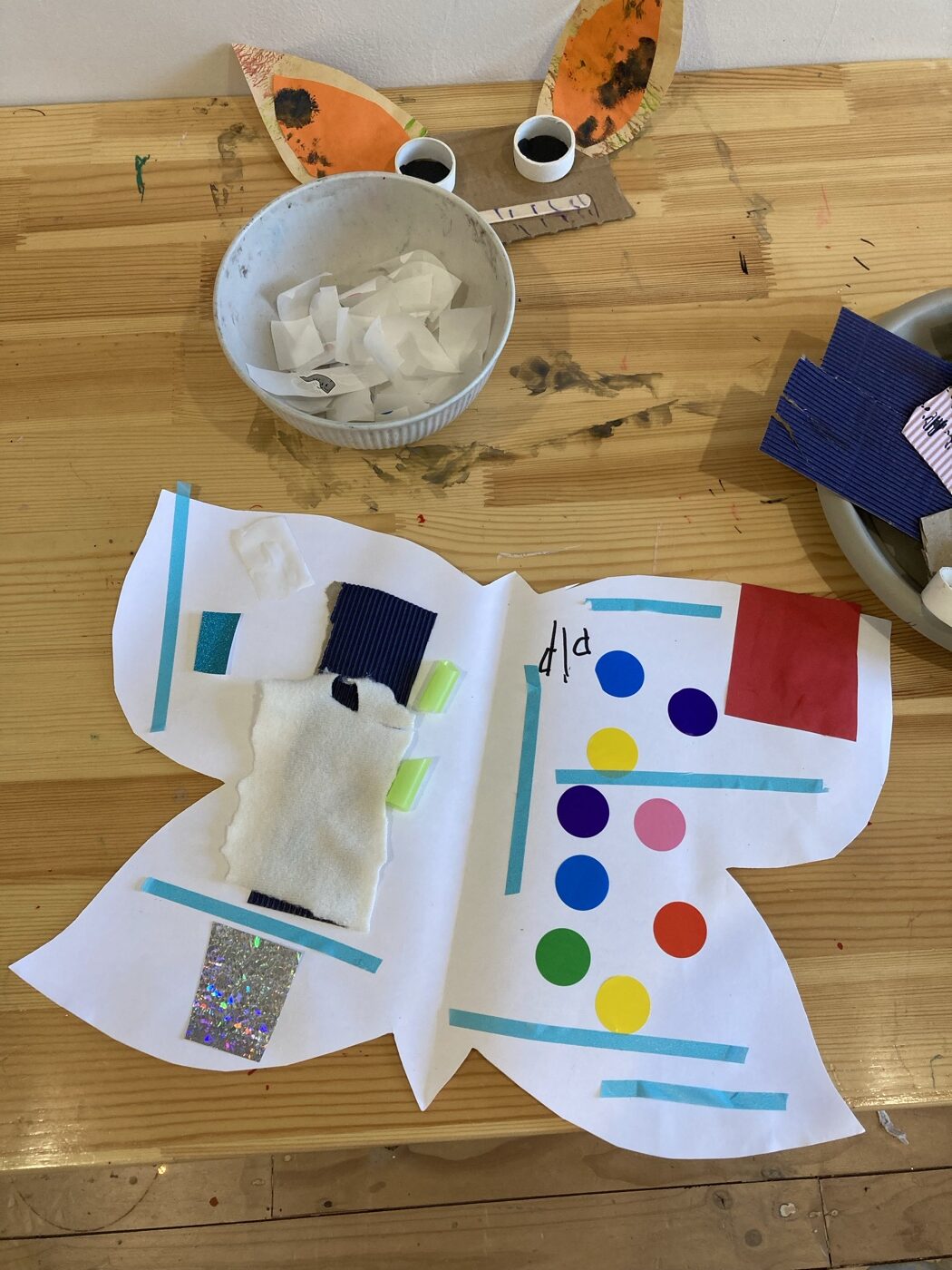 A butterfly collage project made with textured materials at Mini Ivy
