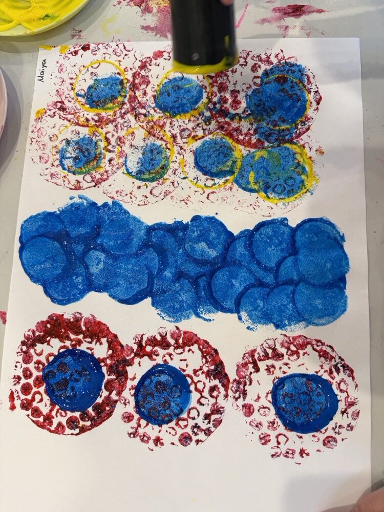 Rows of printed blue and red circles filling a page